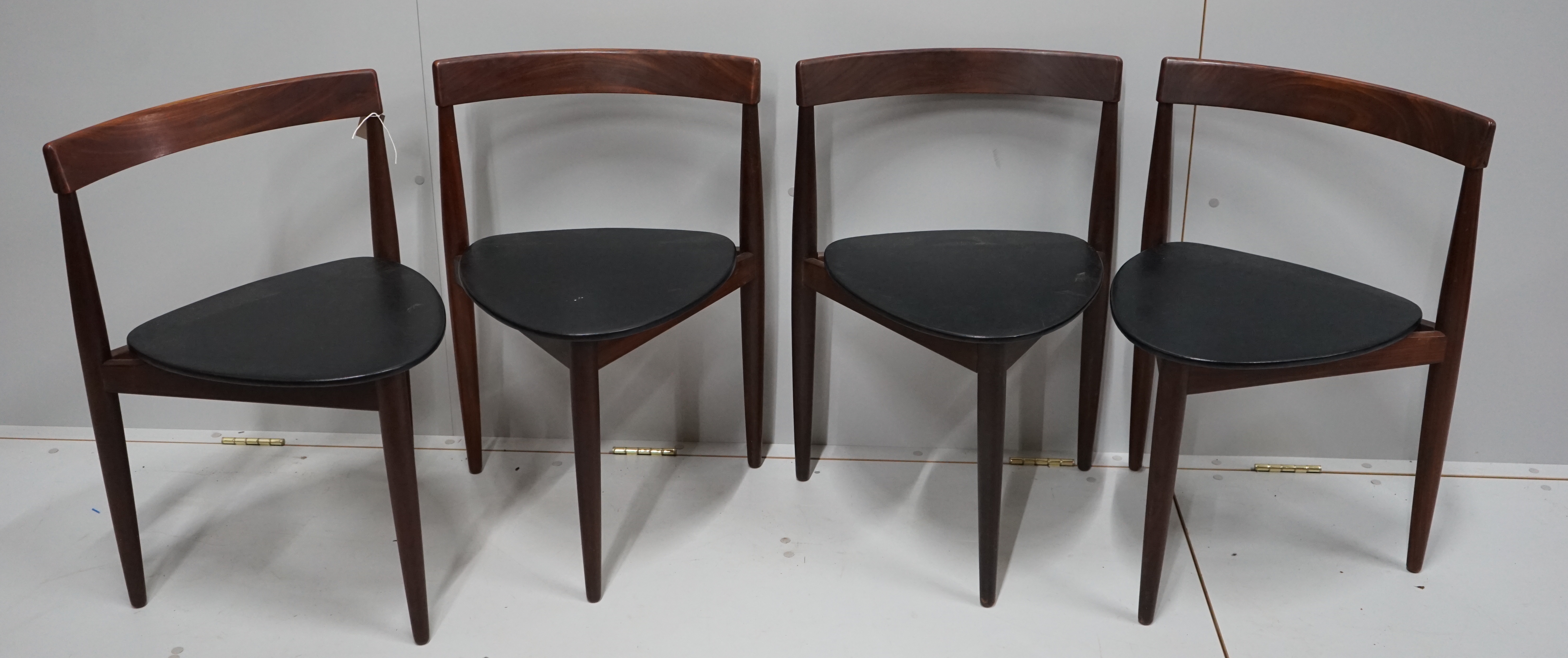 Hans Olsen for Frem Rotle, a set of four aphromosia tripod dining chairs, width 50cm, depth 41cm, height 71cm.